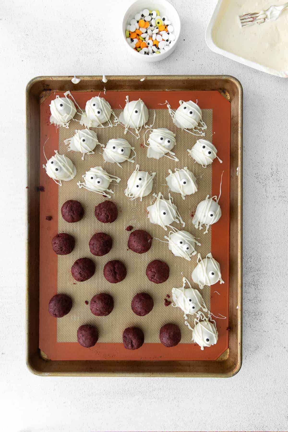 dipped red velvet truffles on baking sheet