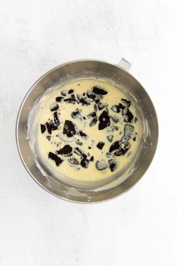 wet oreo cheesecake ingredients in a mixing bowl