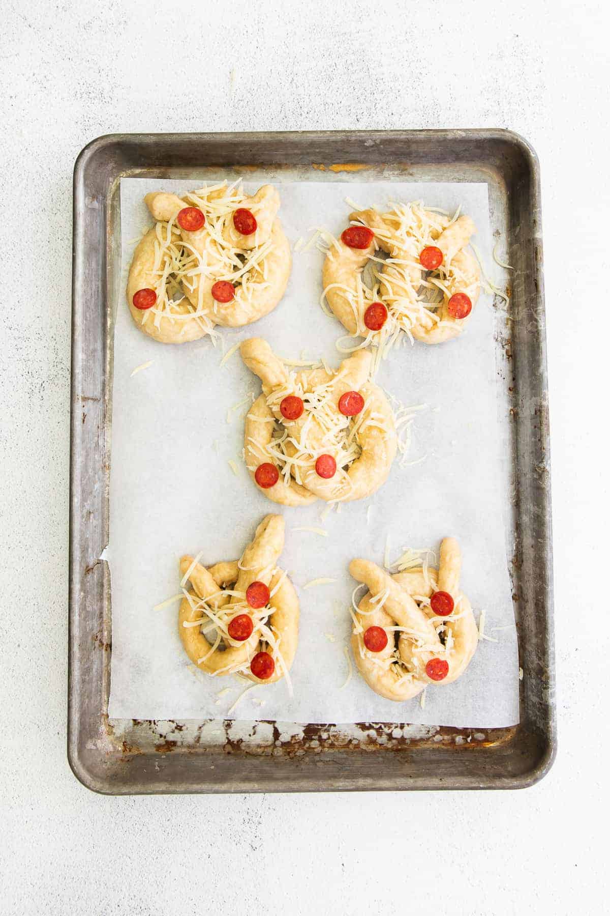 uncooked pretzels on baking sheet