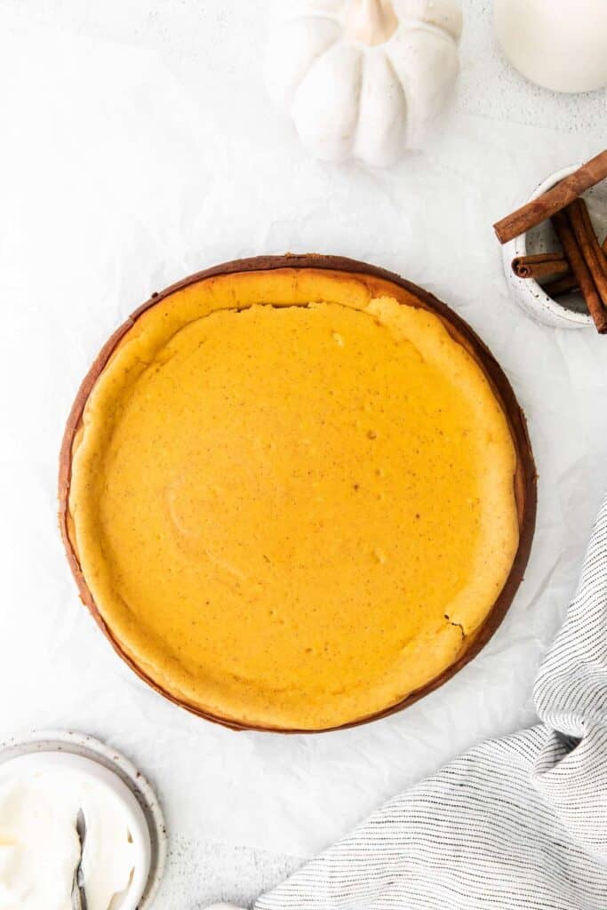 pumpkin chai cheesecake ready to be sliced and served