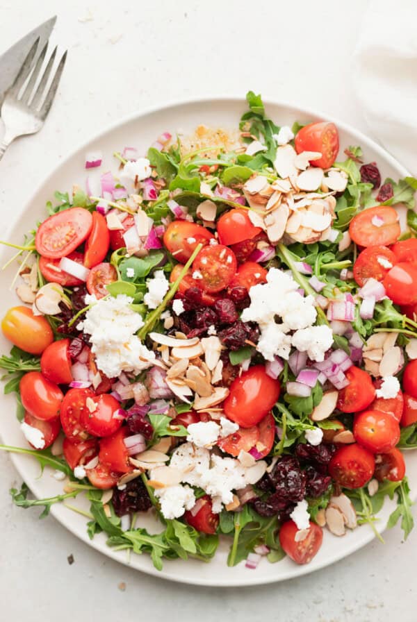 arugula goat cheese salad on a plate