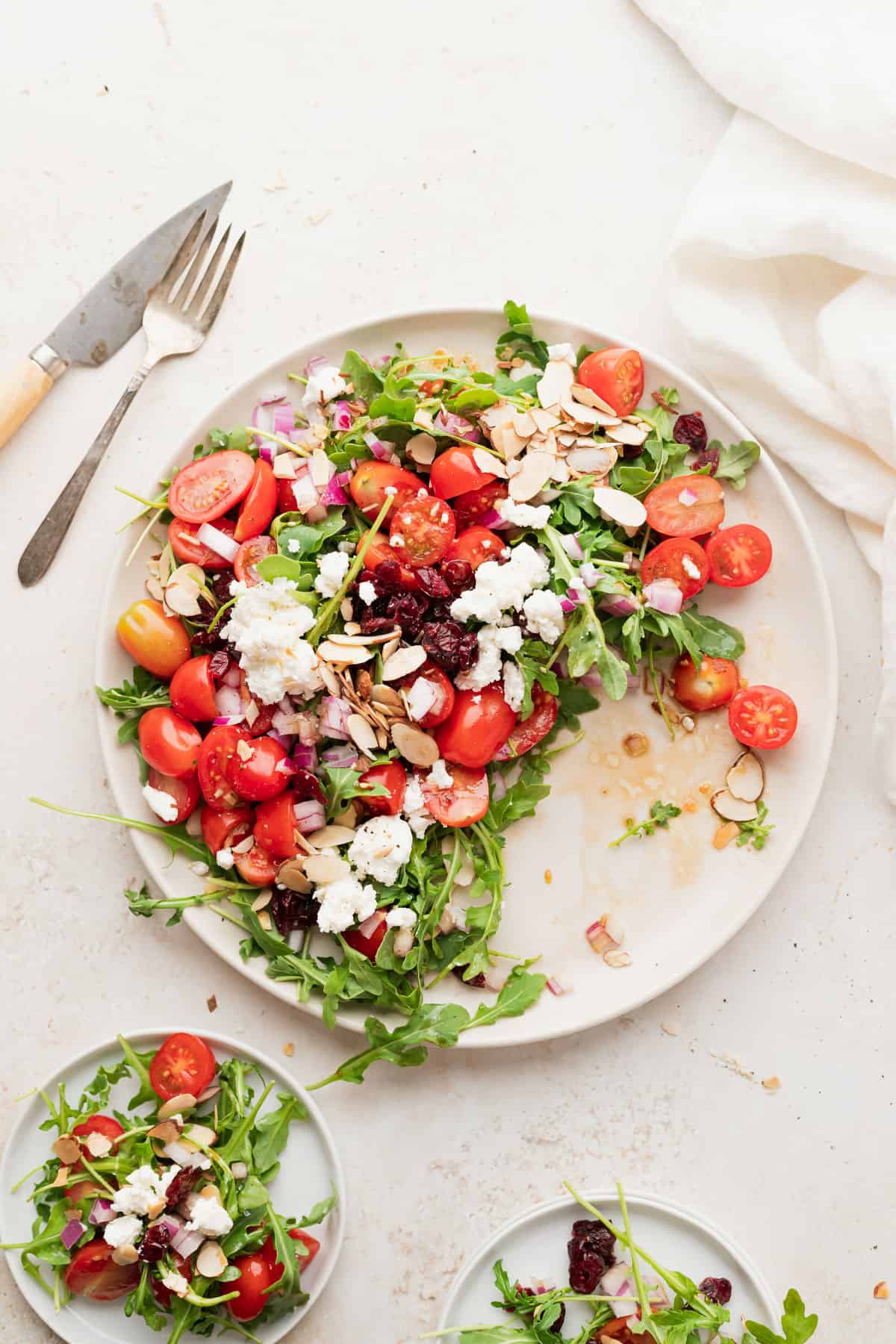 arugula goat cheese salad on a plate ready to be served