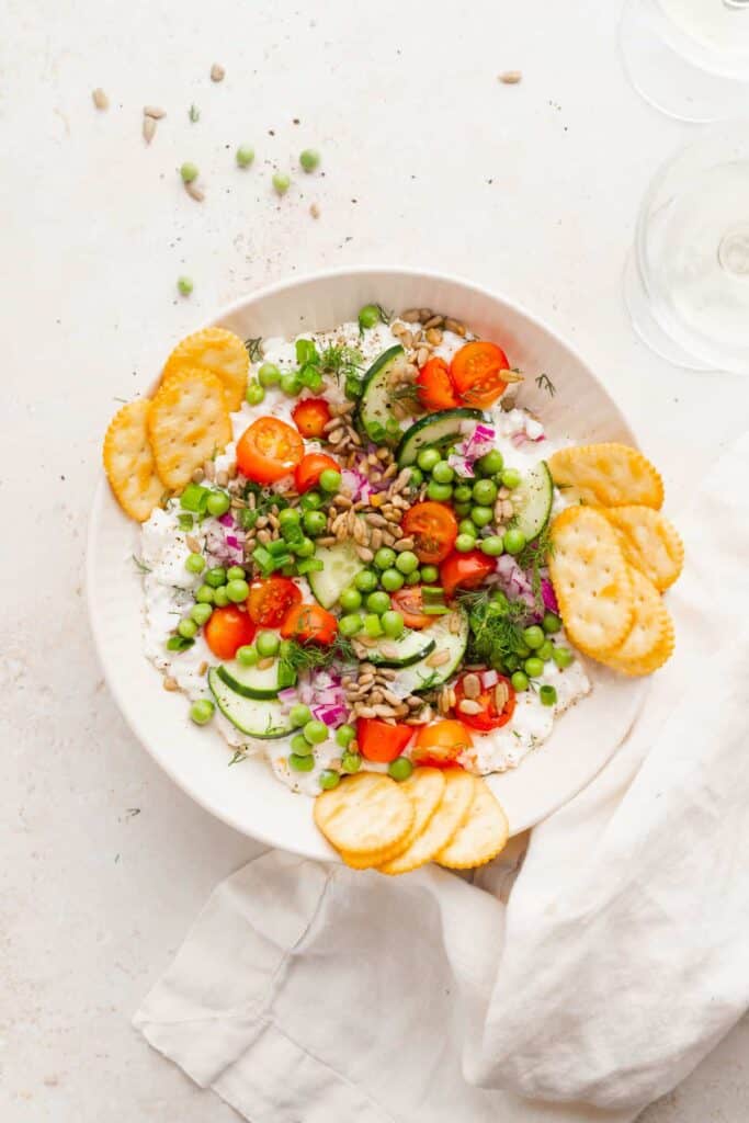cottage cheese salad surrounded by crackers and ready to be served