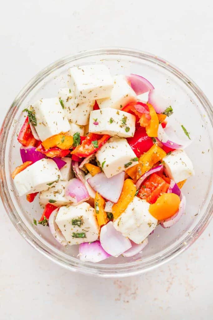 grilled halloumi skewers ingredients in a bowl