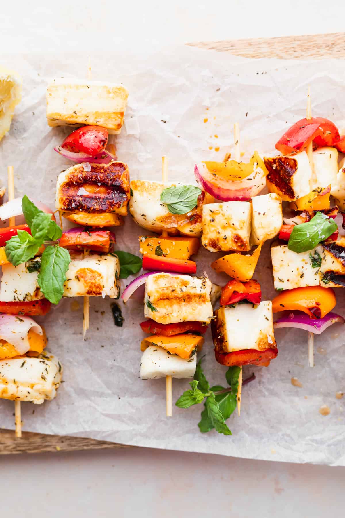 grilled halloumi skewers in a close up photo that highlights the bright vegetables