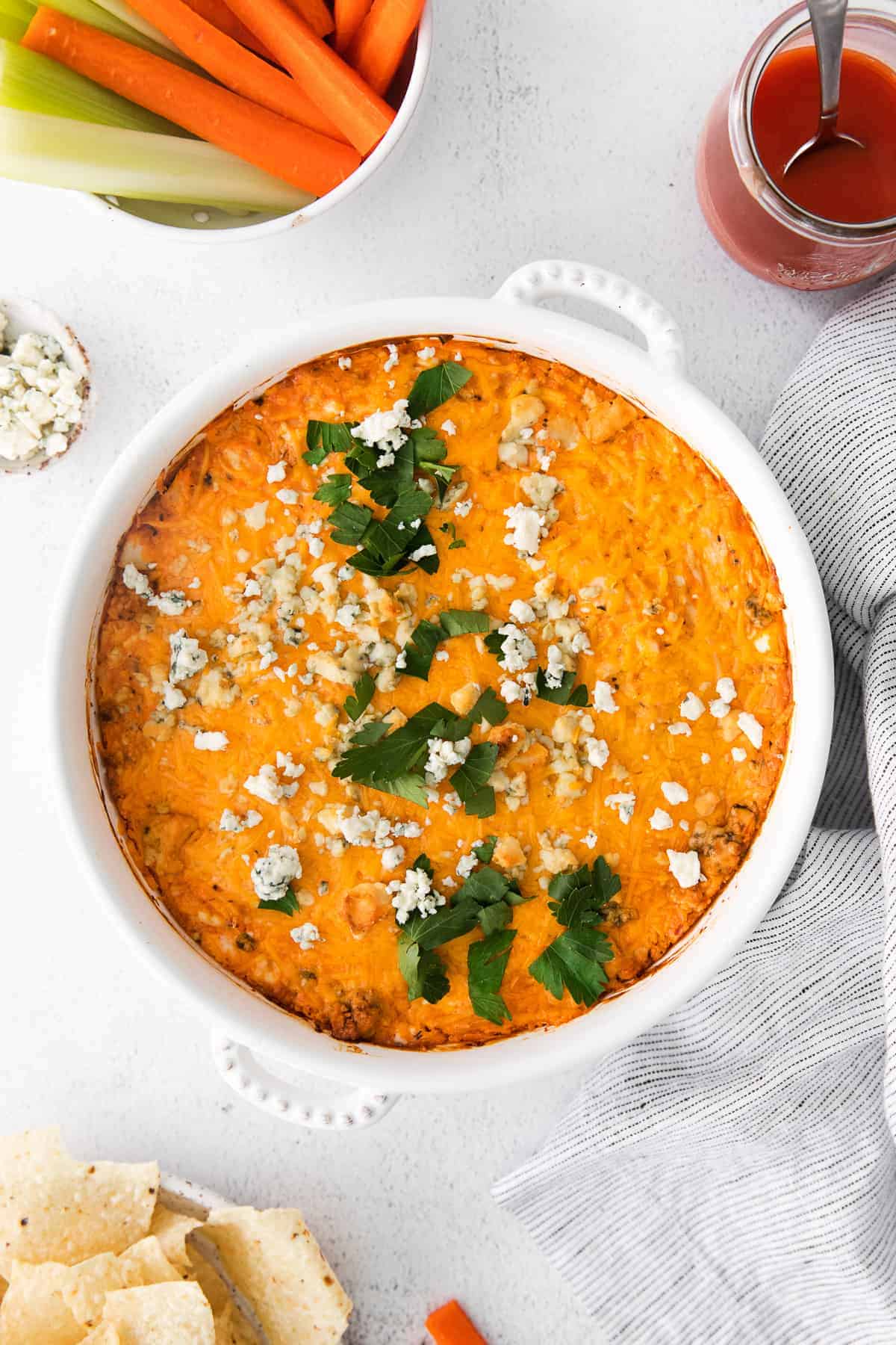 Blue cheese buffalo dip in a casserole dish. 