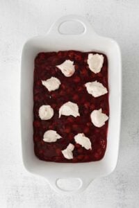 a dessert with cranberry sauce and whipped cream.