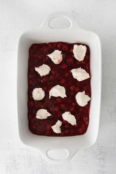 a dessert with cranberry sauce and whipped cream.
