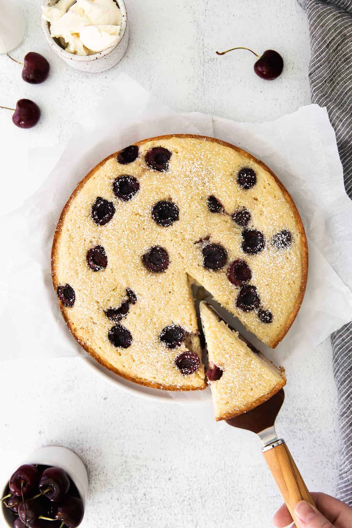 Cherry ricotta cake on counter.