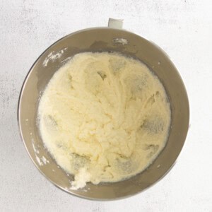 A mixing bowl filled with a delicious mixture of flour and butter, ready for a cherry ricotta cake.