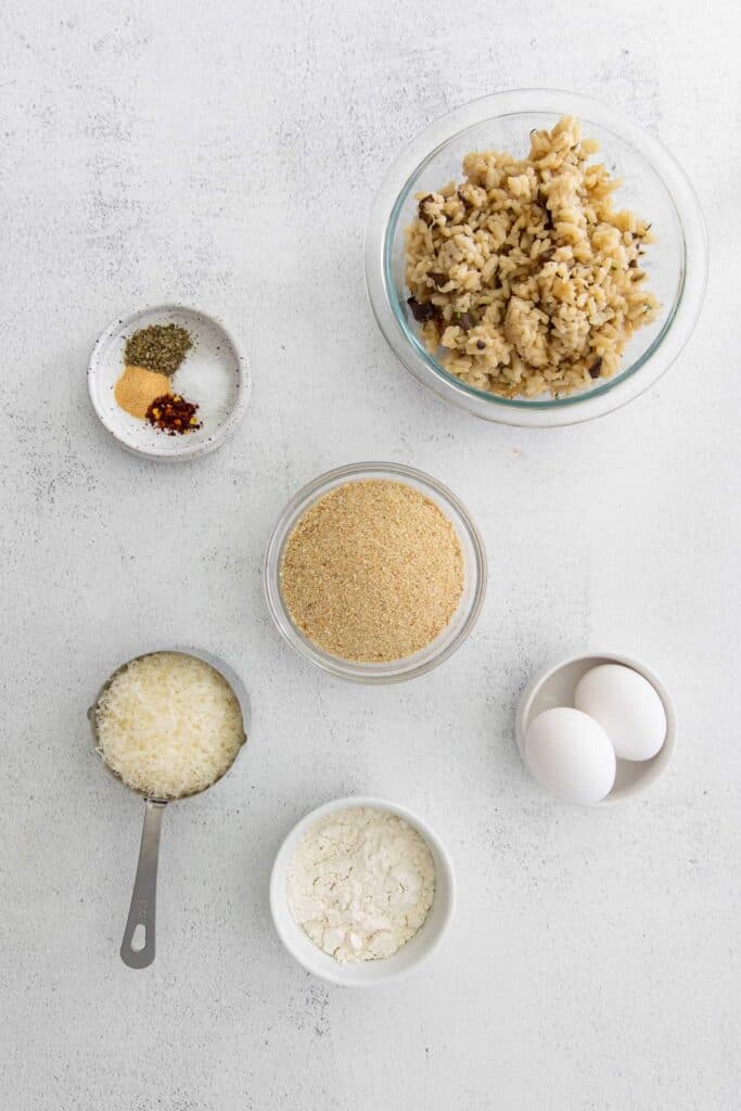 Ingredients for arancini on countertop.