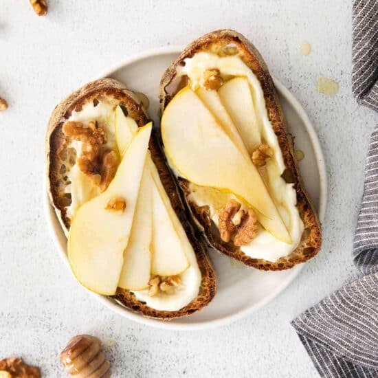 Ricotta toast with pears, walnuts, and honey.