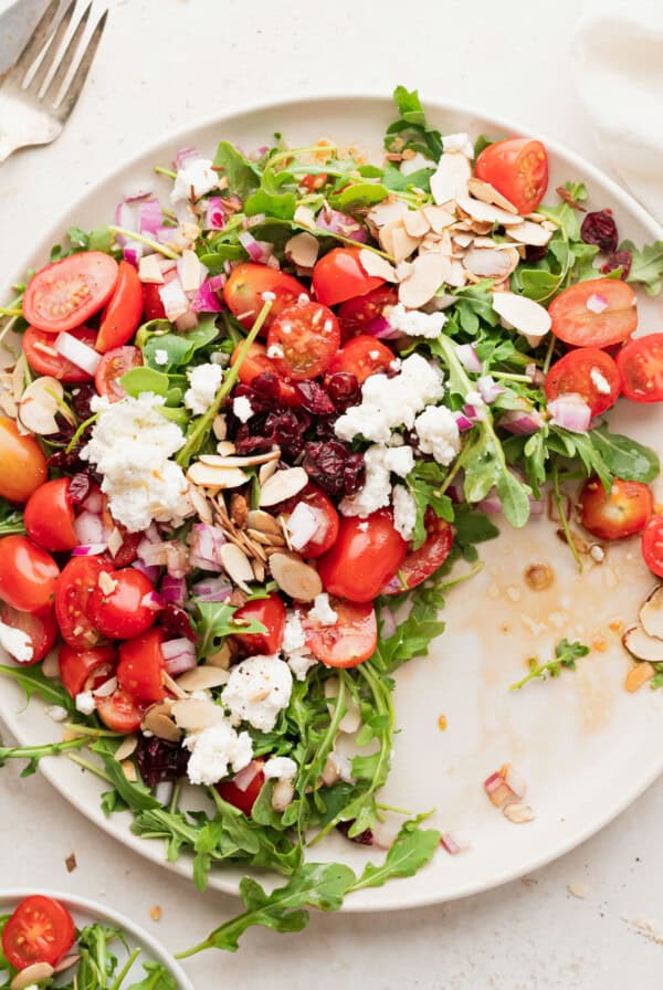 arugula goat cheese salad on a plate