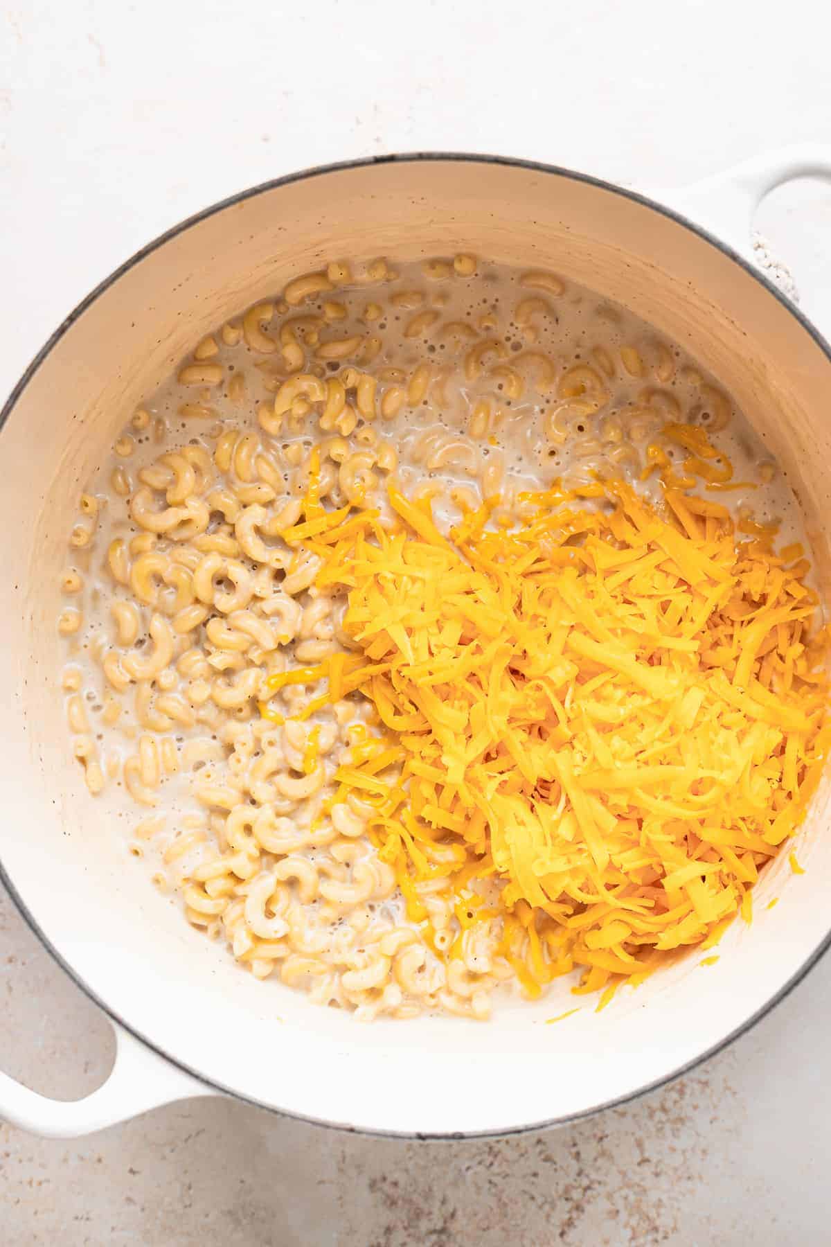 shredded cheese on top of noodles