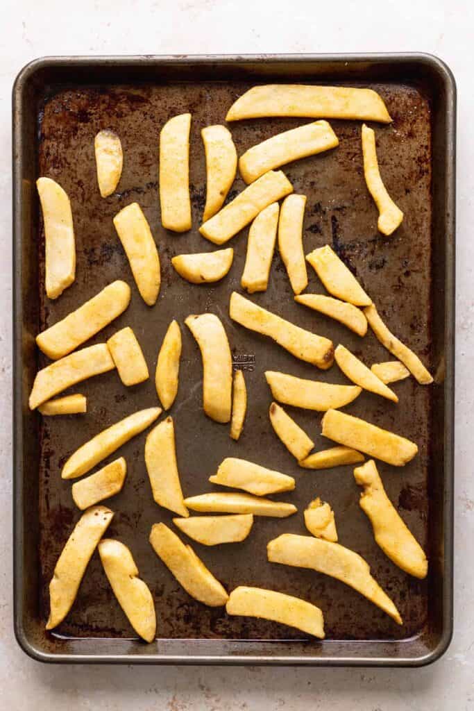 thick cut fries on a baking sheet 