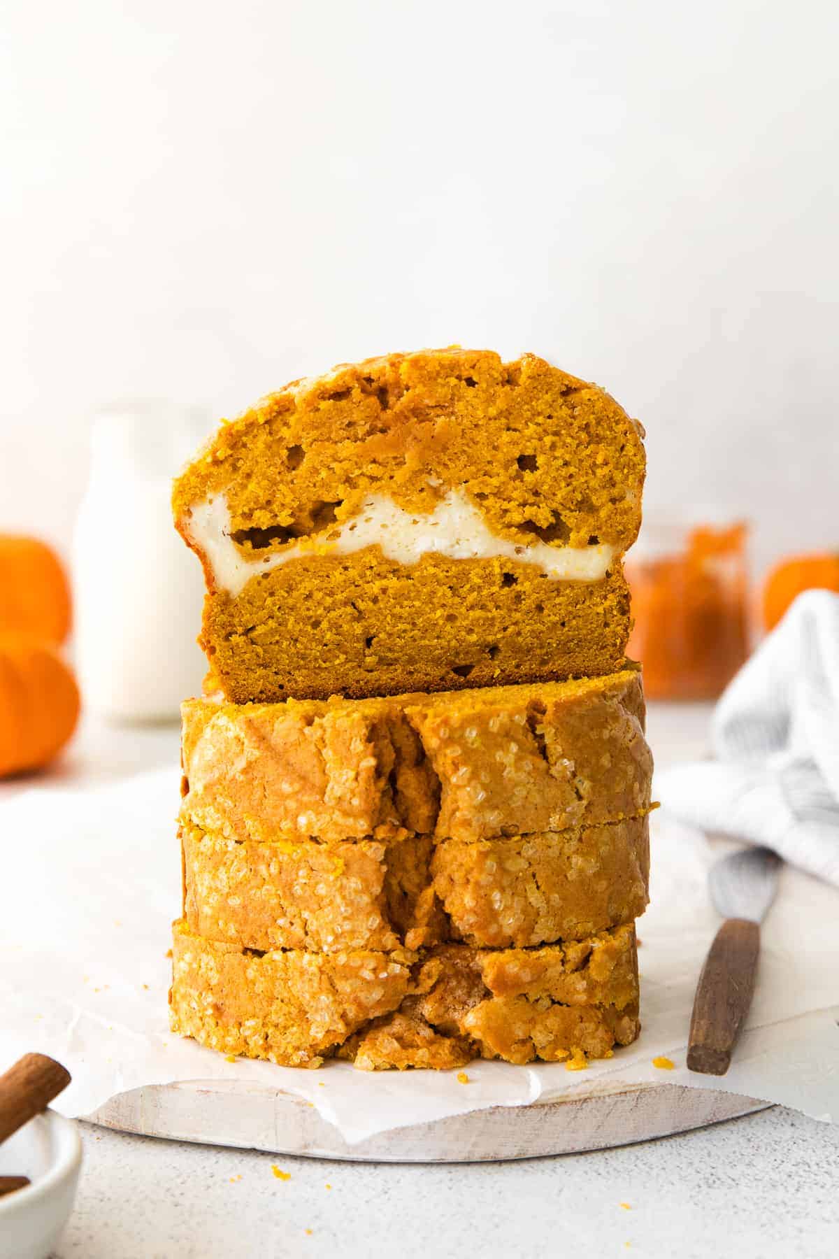 Pumpkin cream cheese bread cut into slices.