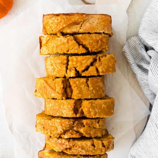 a stack of pumpkin cream cheese bread stacked on top of each other.