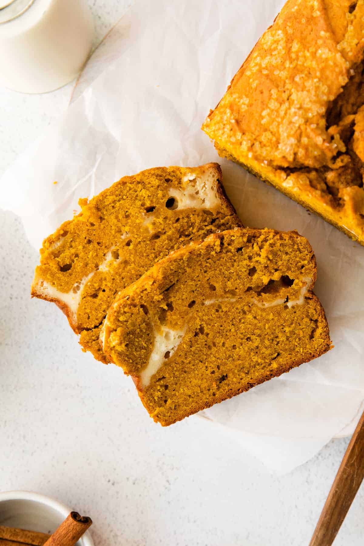 two slices of pumpkin cream cheese bread