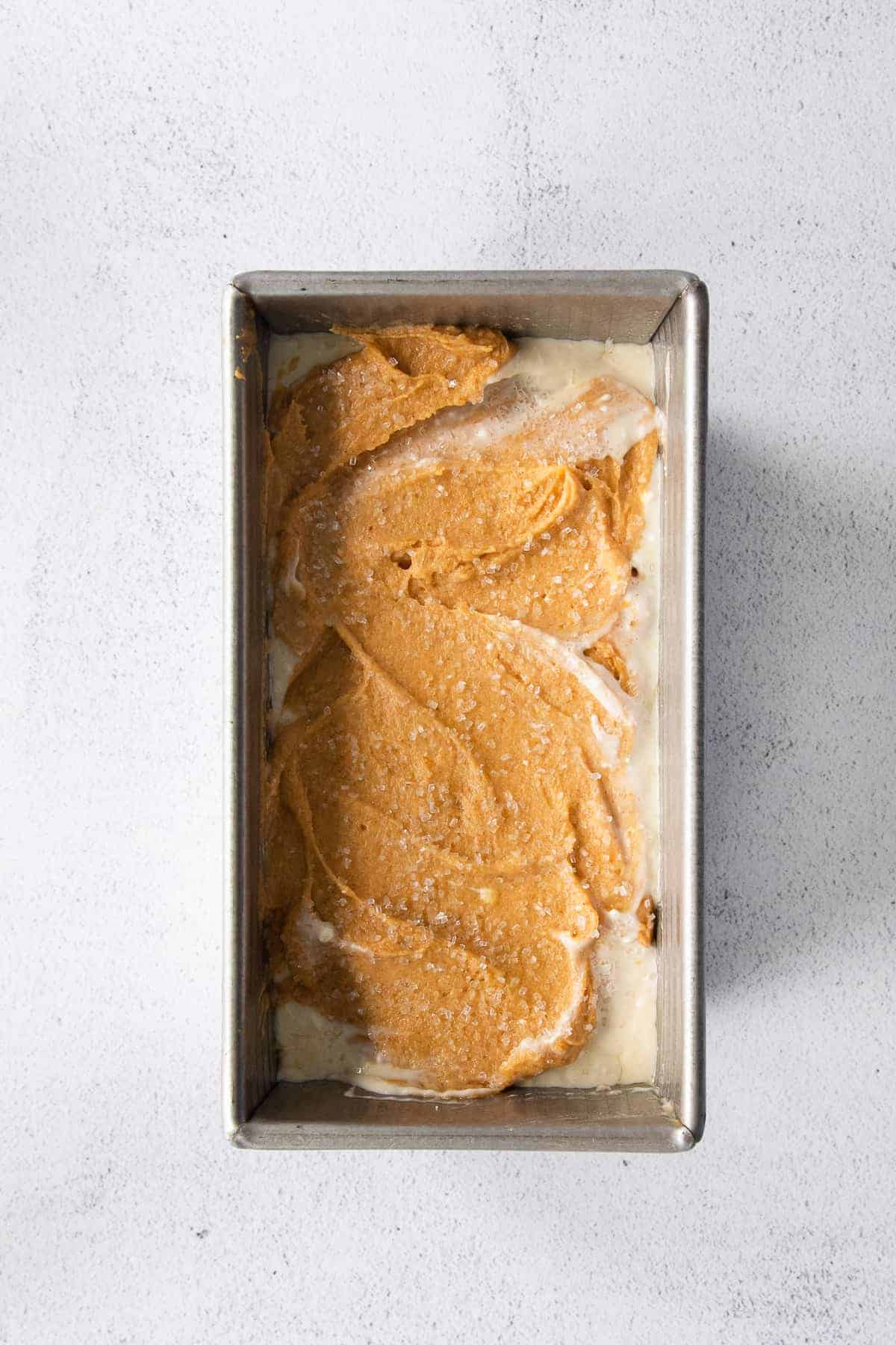 pumpkin cream cheese bread in a loaf pan ready to be baked