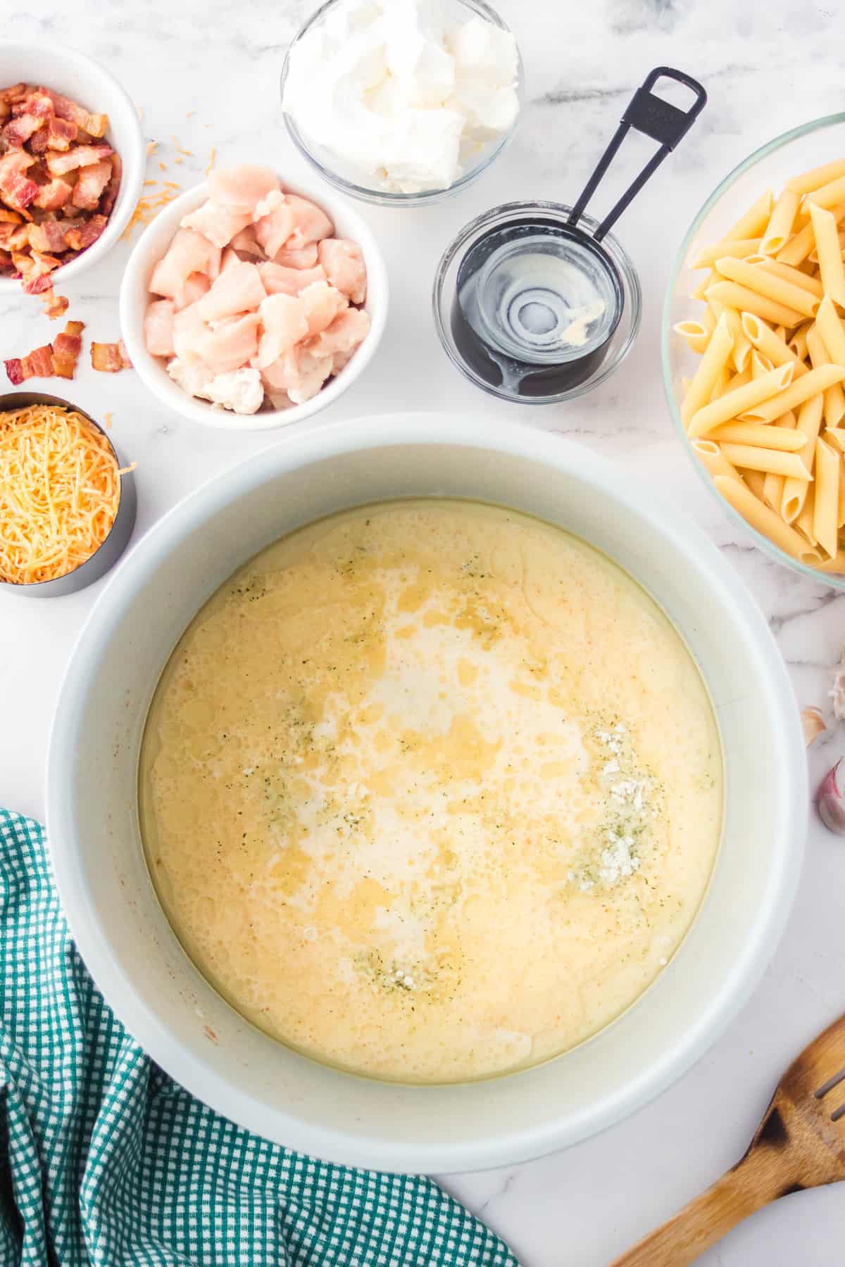 Ingredients for chicken bacon ranch pasta in an instant pot. 