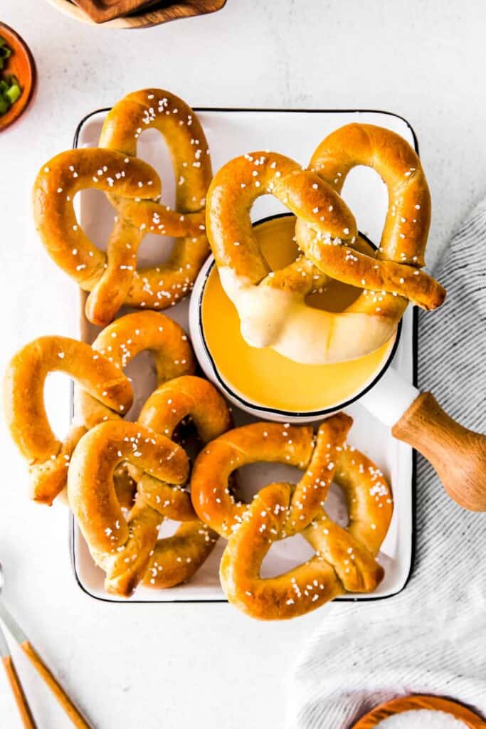A soft pretzel dipped in beer cheese dip. 