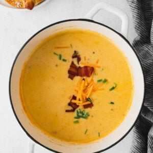 Cheesy beer cheese soup with bacon and pretzels.