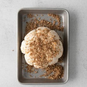 a cookie in a baking pan with granulated sugar on top.