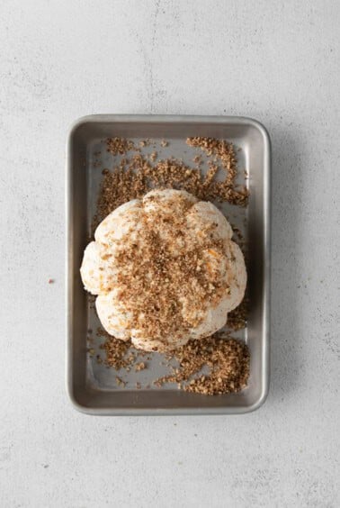 a cookie in a baking pan with granulated sugar on top.