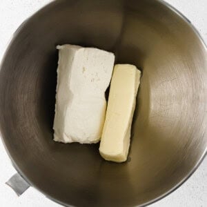 two pieces of butter in a metal bowl.