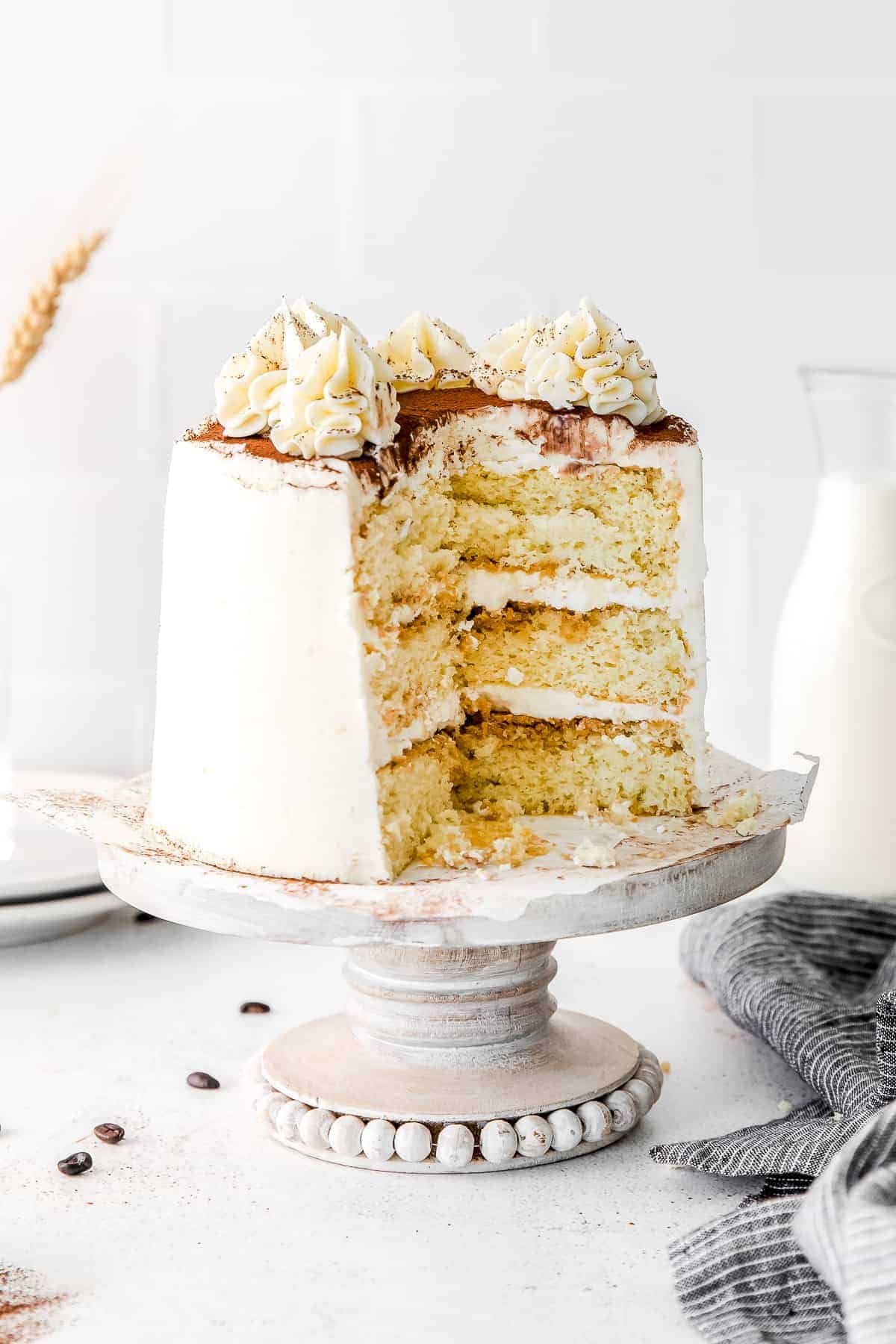 tiramisu layer cake with a slice removed 