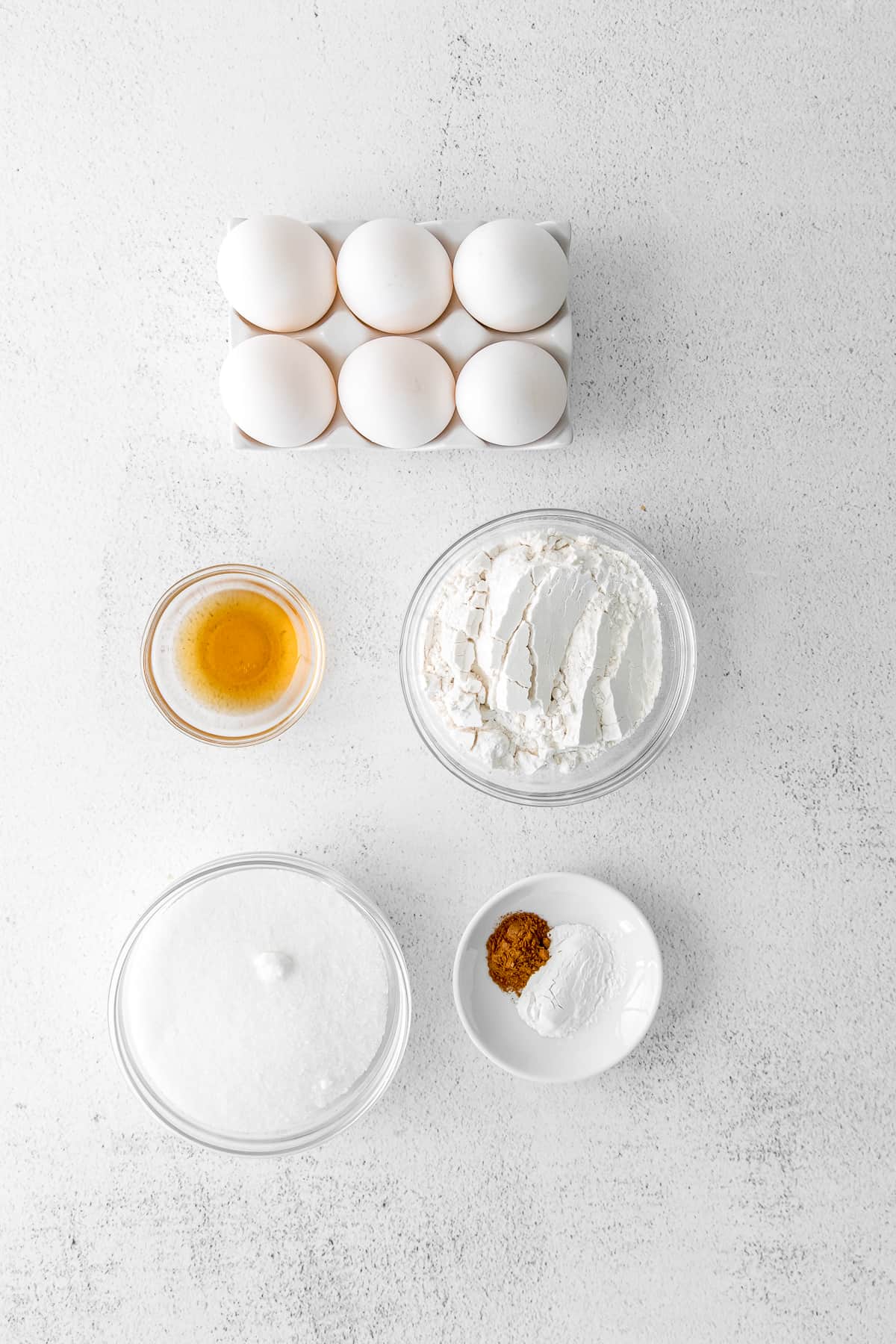 ingredients for tiramisu layer cake in small bowls