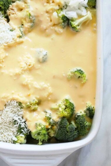 A casserole dish filled with broccoli and cheese.
