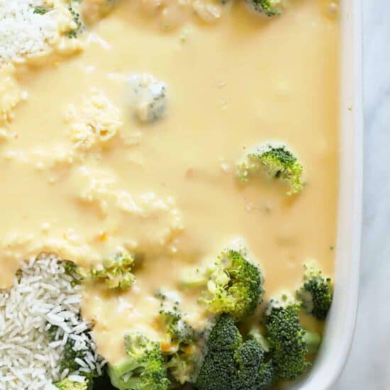 A casserole dish filled with broccoli and cheese.