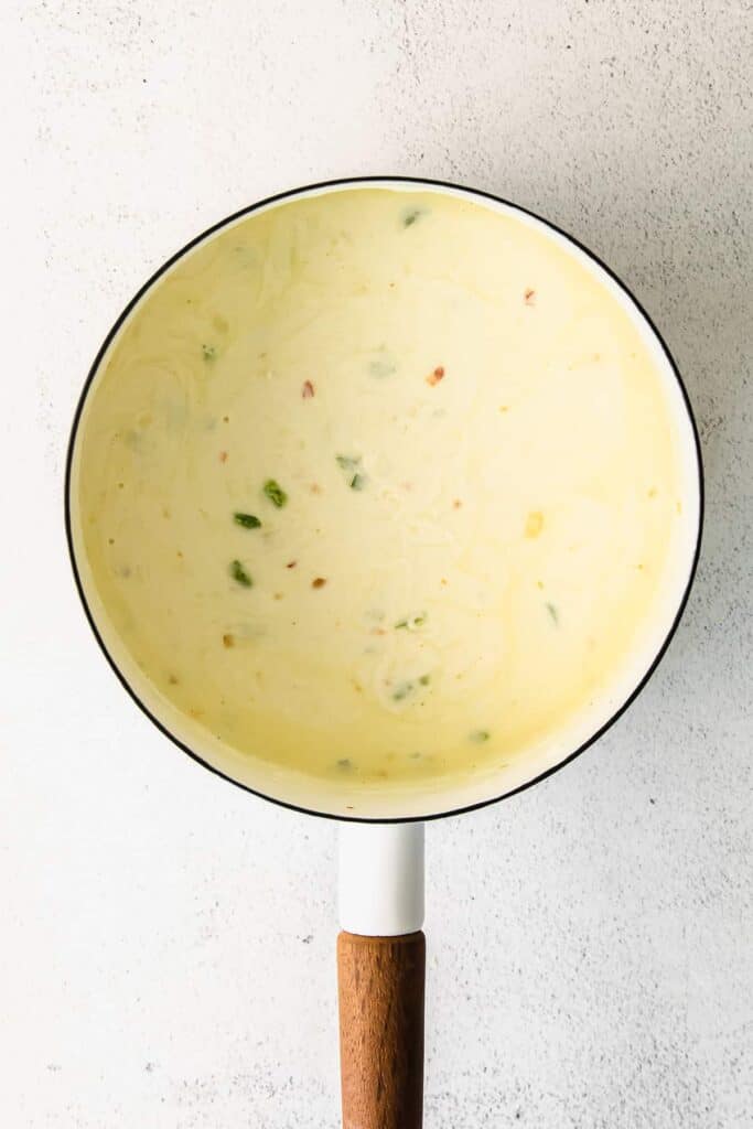 Homemade queso dip in a pot.