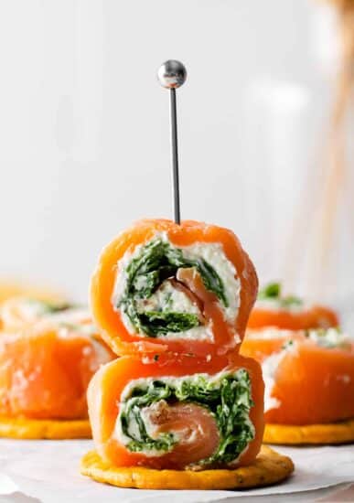 salmon and spinach rolls with a toothpick in the middle.