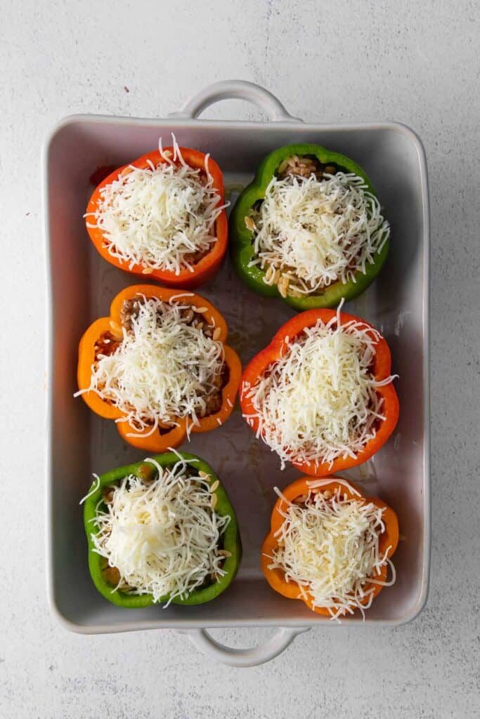peppers with shredded cheese on top
