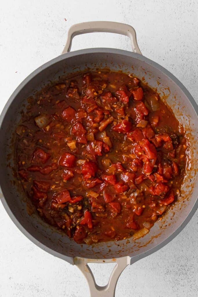 tomatoes and meat in pan