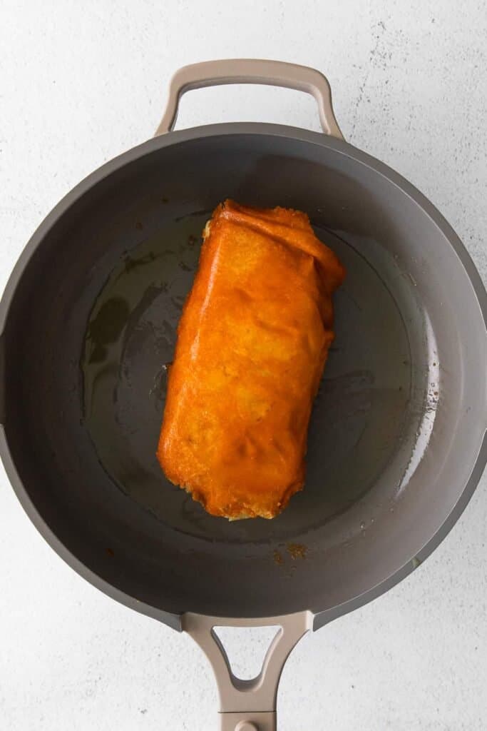 Taco Bell Grilled Cheese Burrito in the pan. 