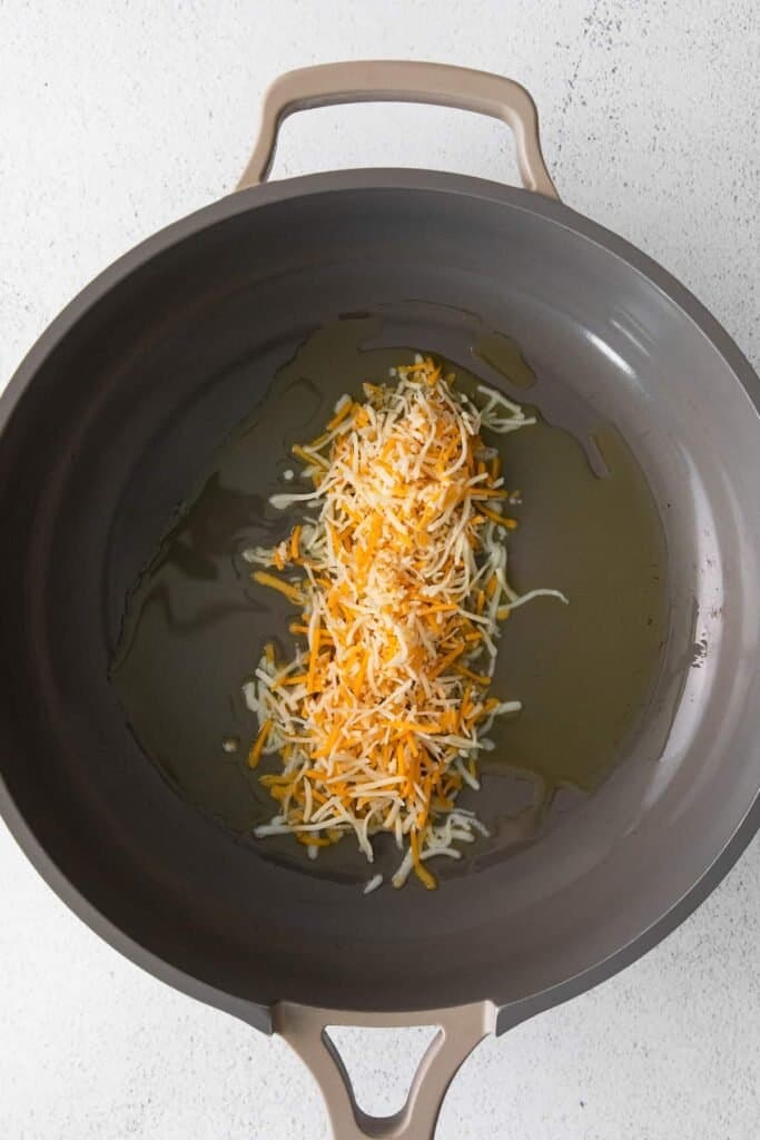 Shredded cheese in a pan. 