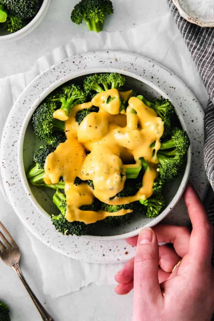 Cheese sauce on broccoli.
