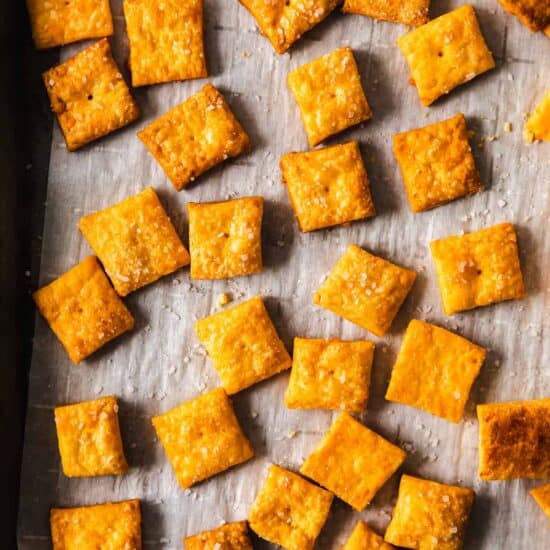 cheesy crackers on a baking sheet.