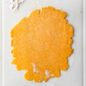 a piece of dough on a cutting board.