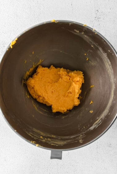 mashed sweet potato in a mixing bowl.