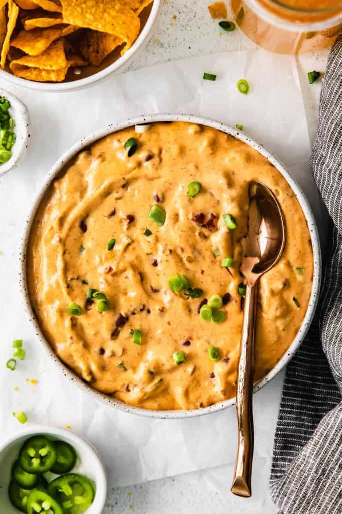 chili cheese dip in a bowl with a spoon
