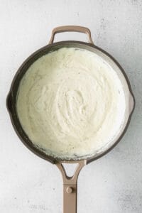 creamy sauce in a skillet.