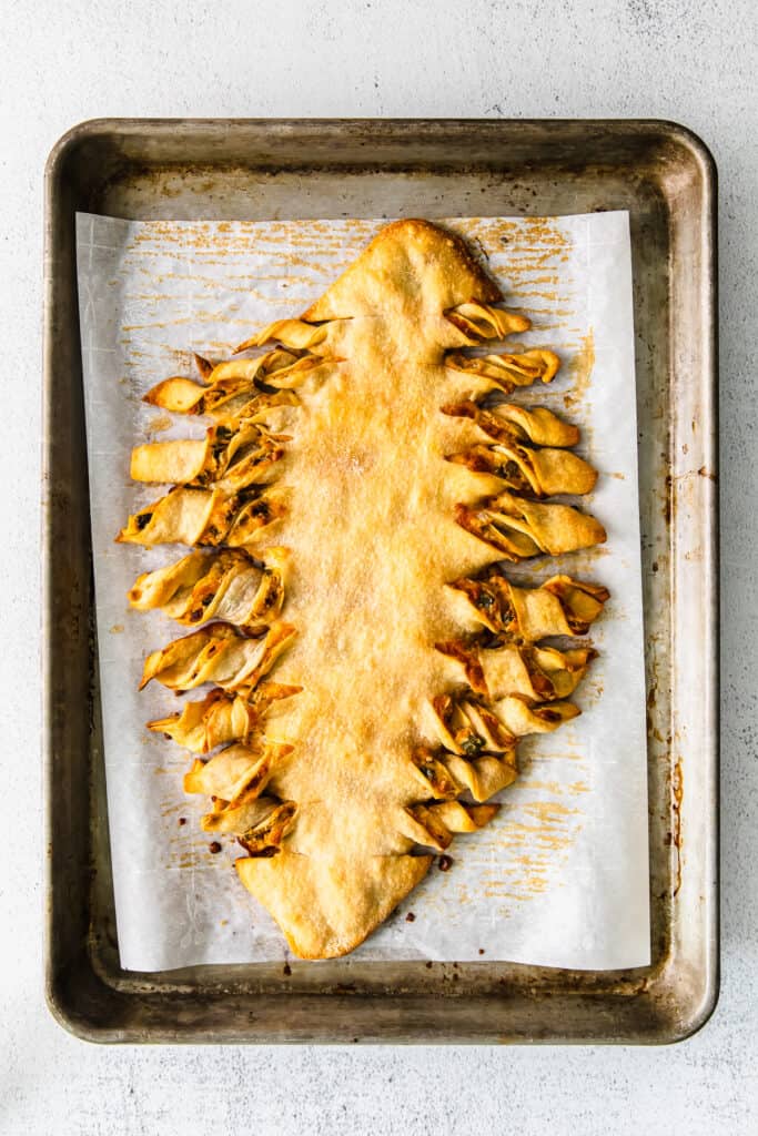 football cheesy breadsticks on a baking sheet