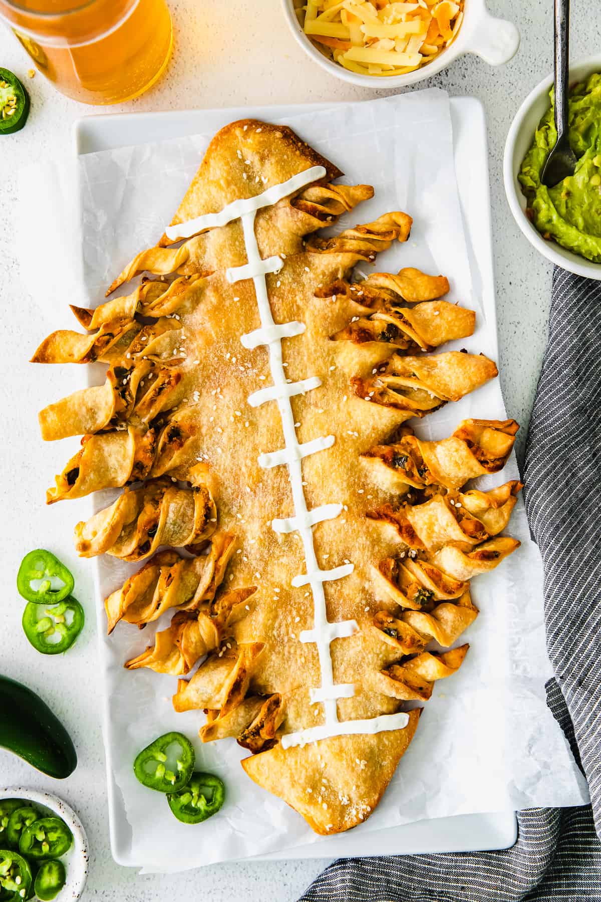 football cheesy breadsticks topped with sour cream ready to be served