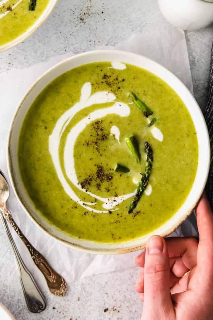 Roasted asparagus soup in bowl.