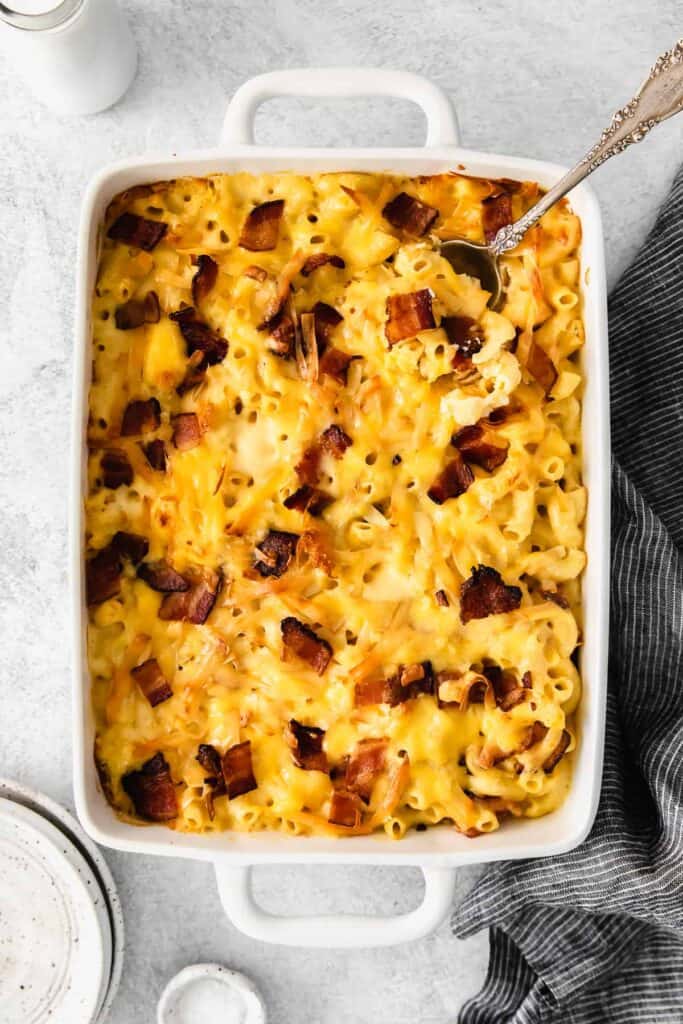 Bacon mac and cheese in a casserole dish. 