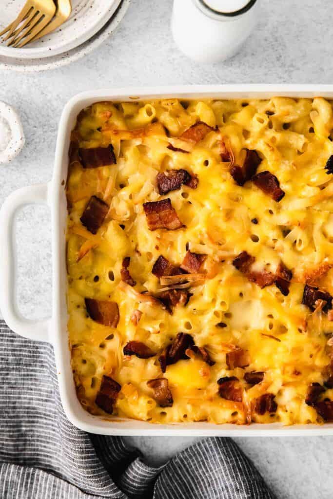 Bacon mac and cheese in a casserole dish. 